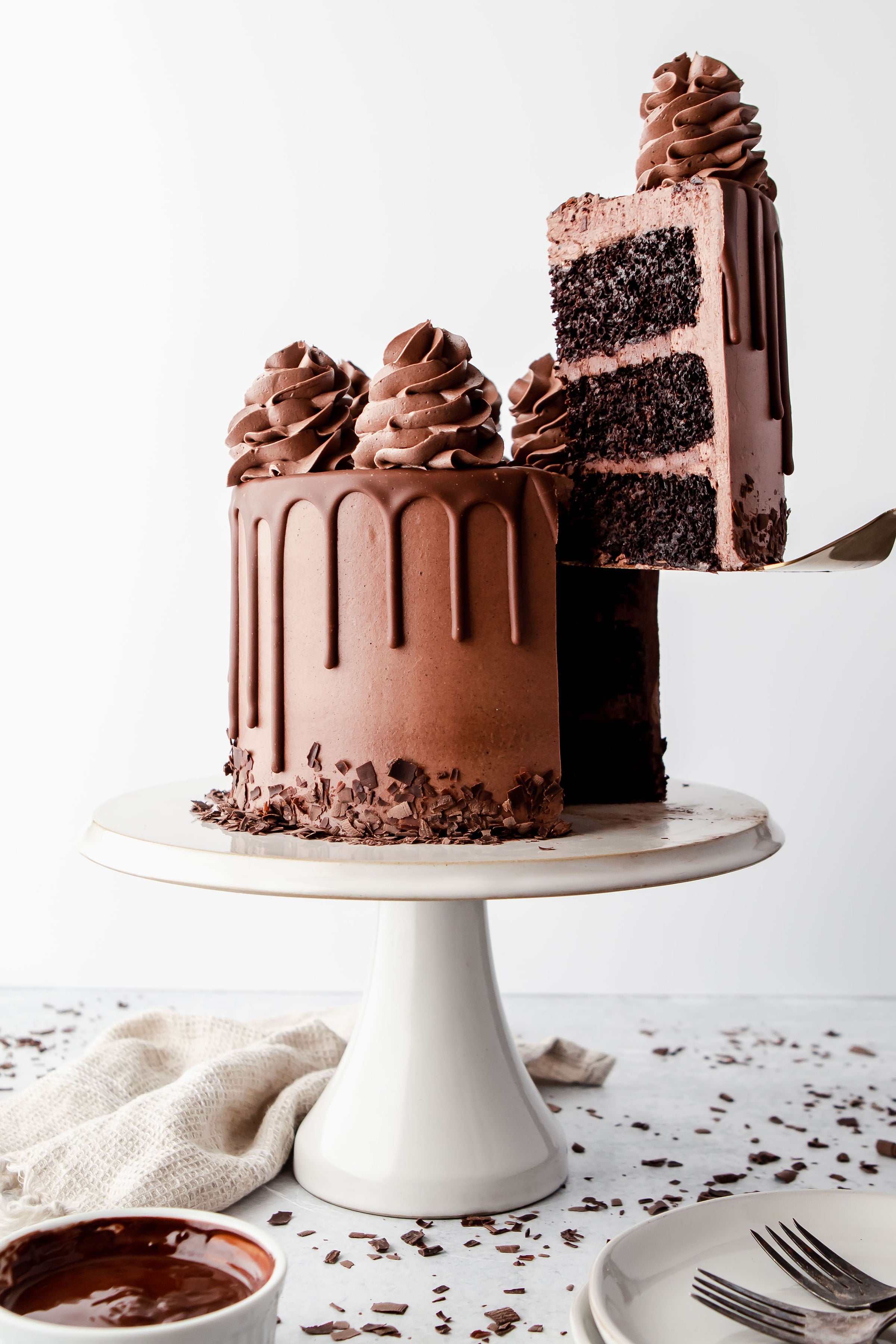 An indulgent chocolate cake with all sorts of chocolate dripped all over  cake – Creme Castle